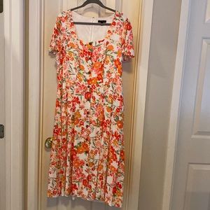 Pocketed dress floral zipper back faux button front
